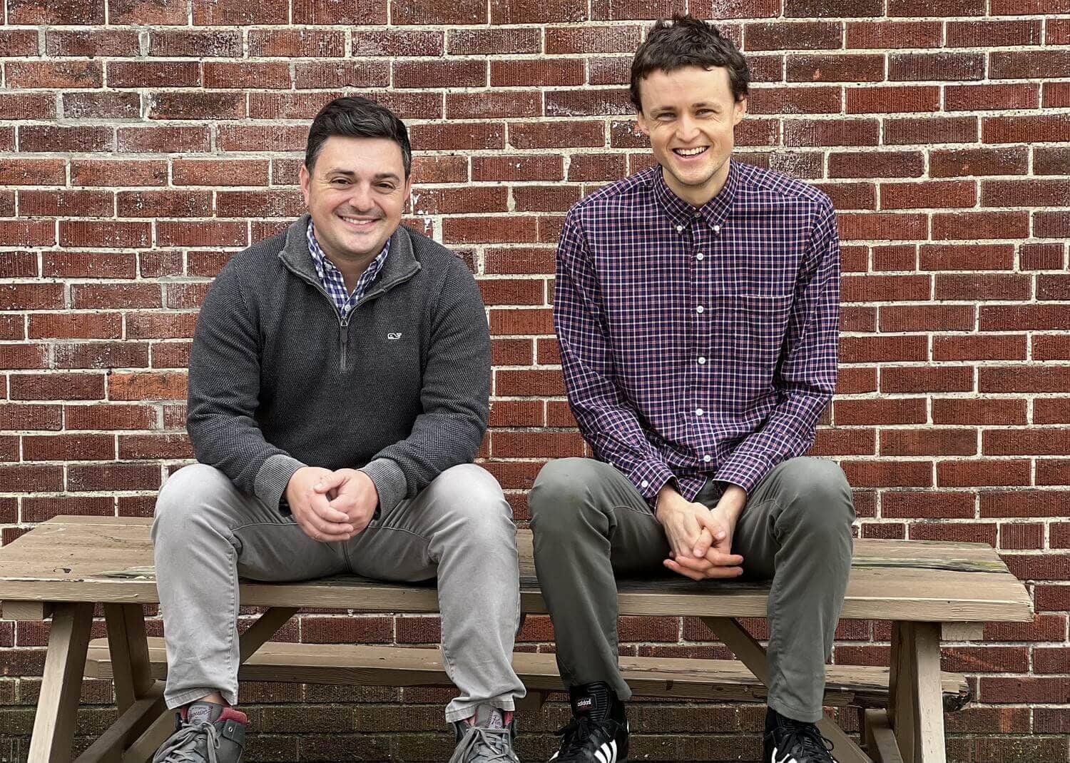 Pat Carroll and Peter Schrock, founders of The Paint By Number Mural Co., standing in their Columbus studio